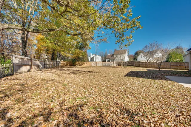 a view of swimming pool with a yard