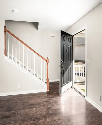 a view of entryway with wooden floor