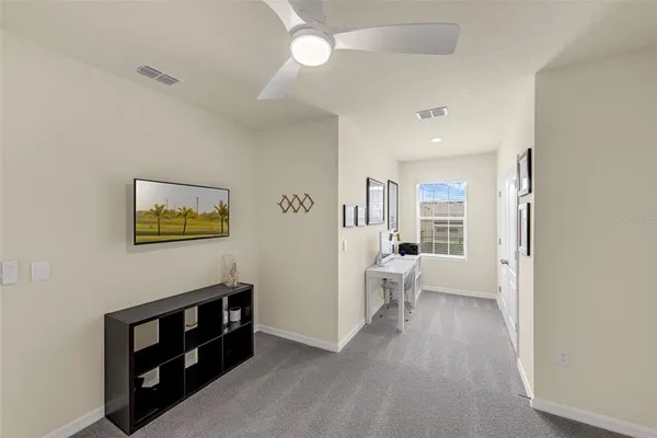 a view of living room with furniture and wooden floor