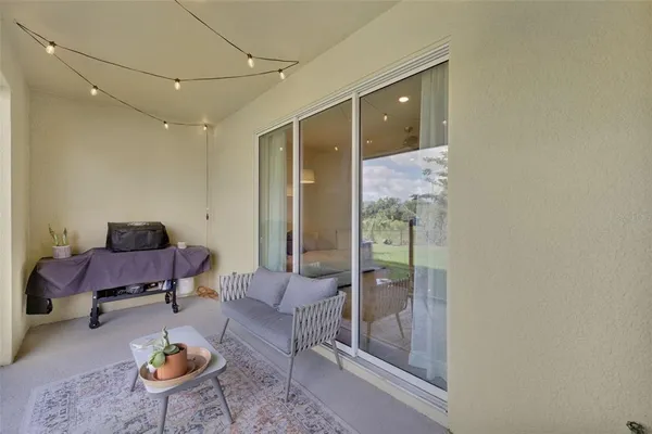a living room with furniture and a rug