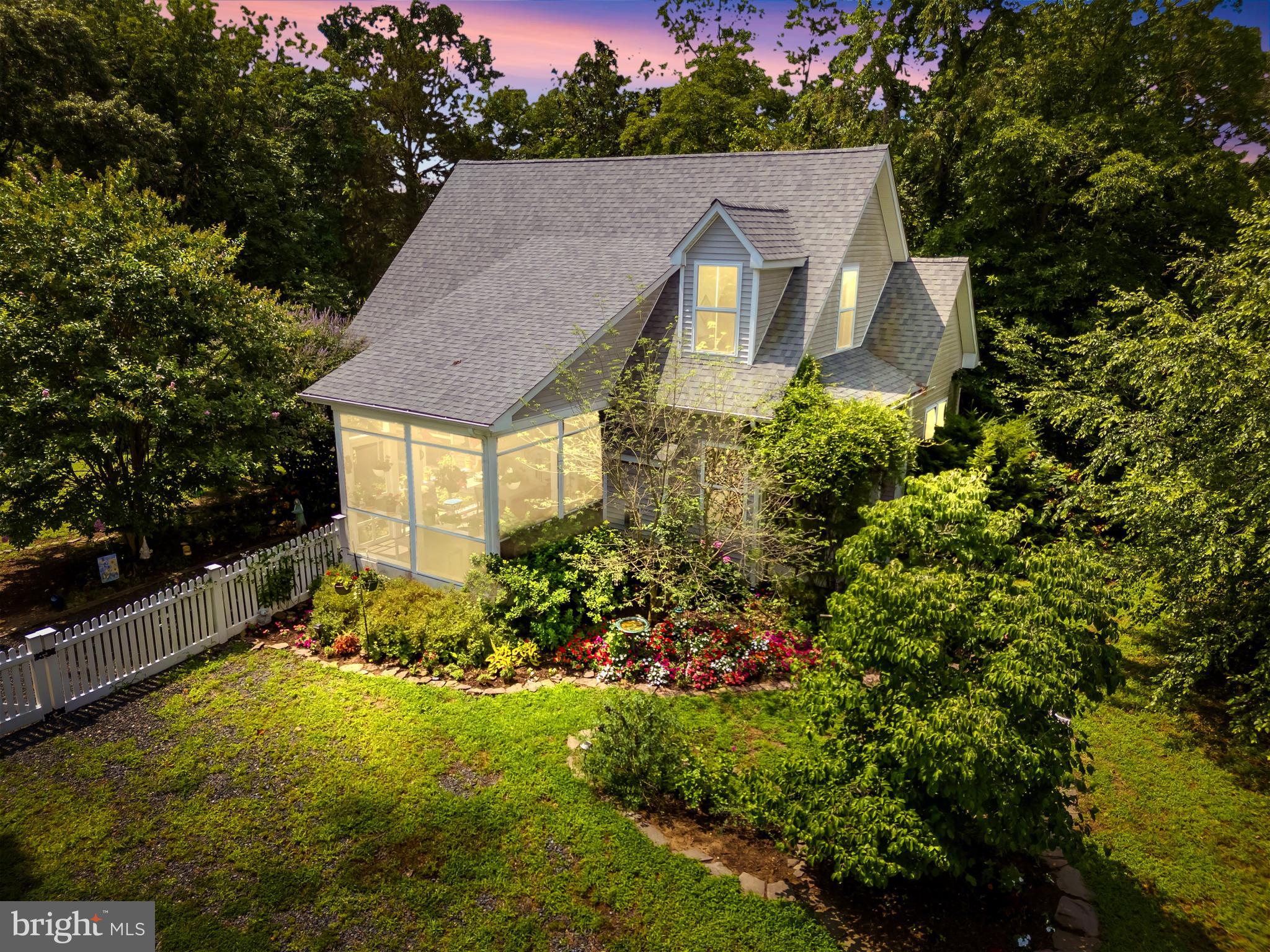 321 Front Street Crumpton, MD 21628 - Photo 3 of 59 a aerial view of a house with a yard and potted plants