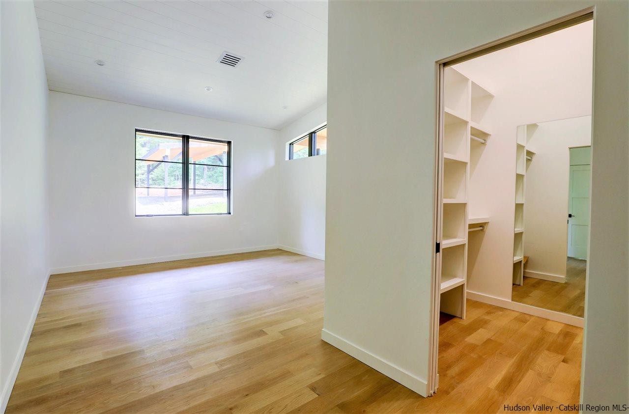 10 Hidden Mountain Stone Ridge, NY 12484 - Photo 15 of 35 a view of a room with wooden floor and a bathroom