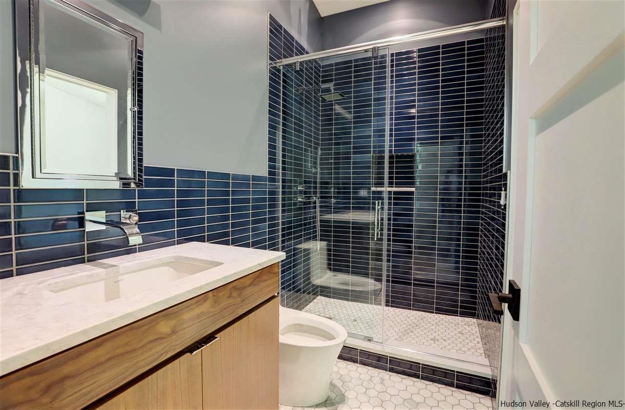 10 Hidden Mountain Stone Ridge, NY 12484 - Photo 19 of 35 a bathroom with a sink toilet and shower