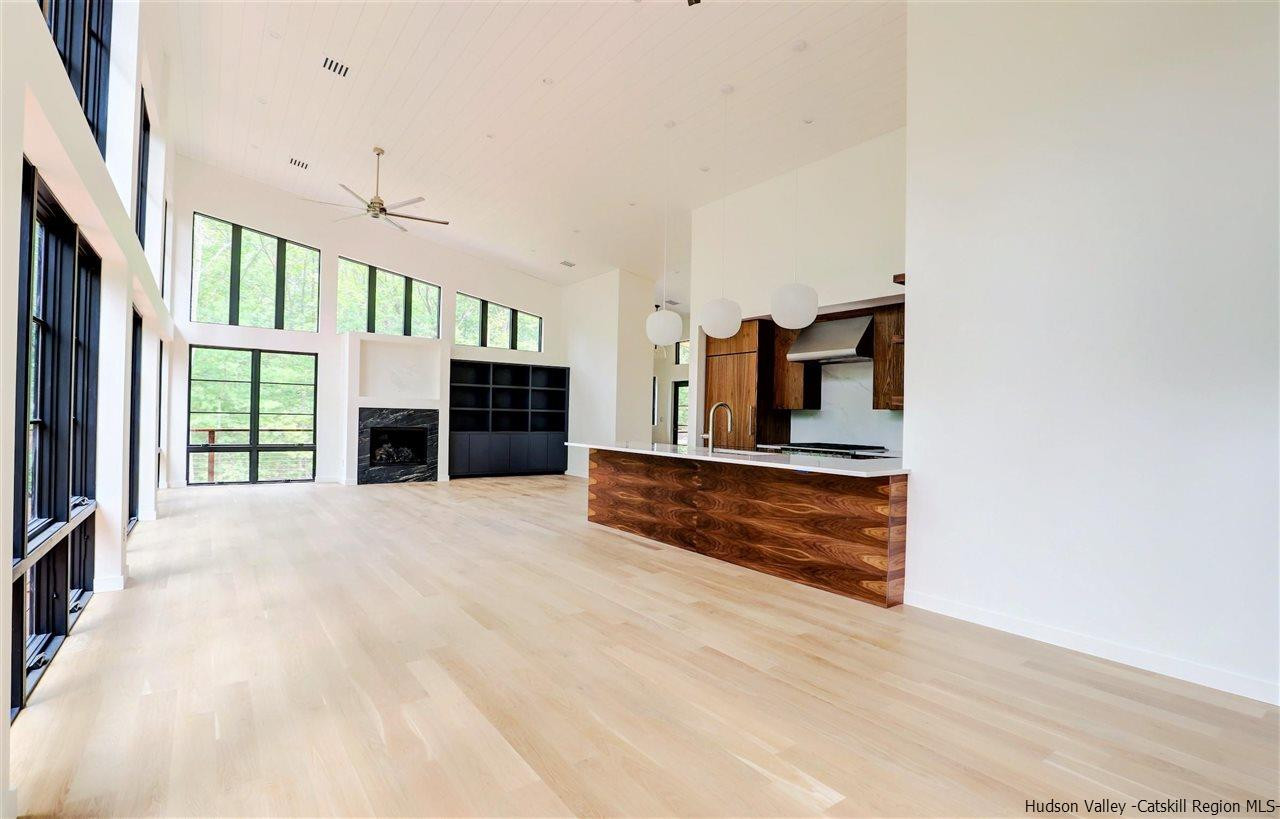 10 Hidden Mountain Stone Ridge, NY 12484 - Photo 10 of 35 a view of an empty room with a fireplace and a window