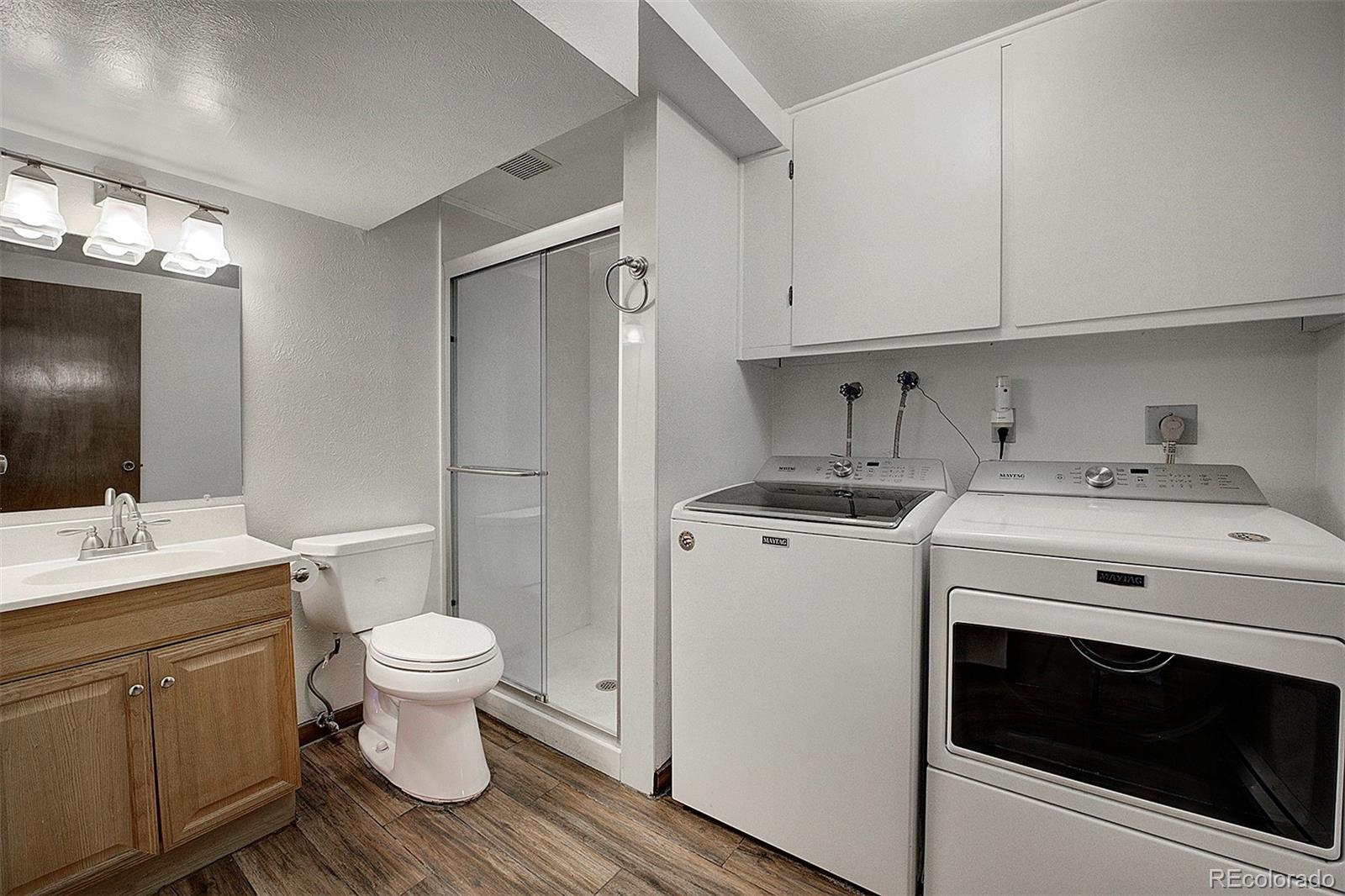 6561 Ridgeview Drive Morrison, CO 80465 - Photo 25 of 36 a view of bathroom with a sink toilet and a mirror