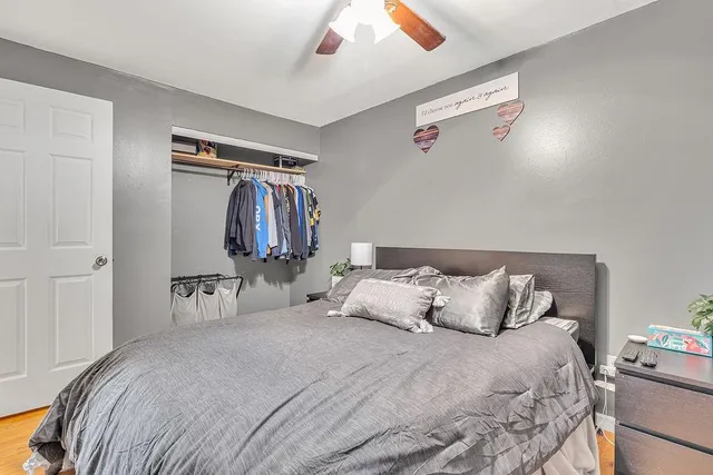 a bedroom with a bed and a lamp