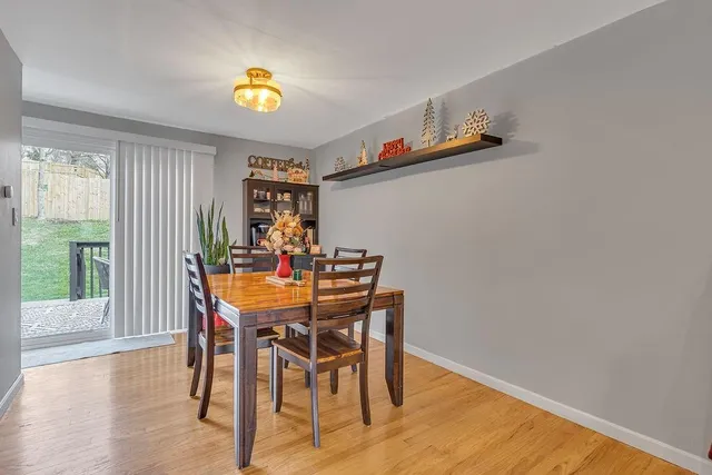 a view of a dining room with furniture and a window