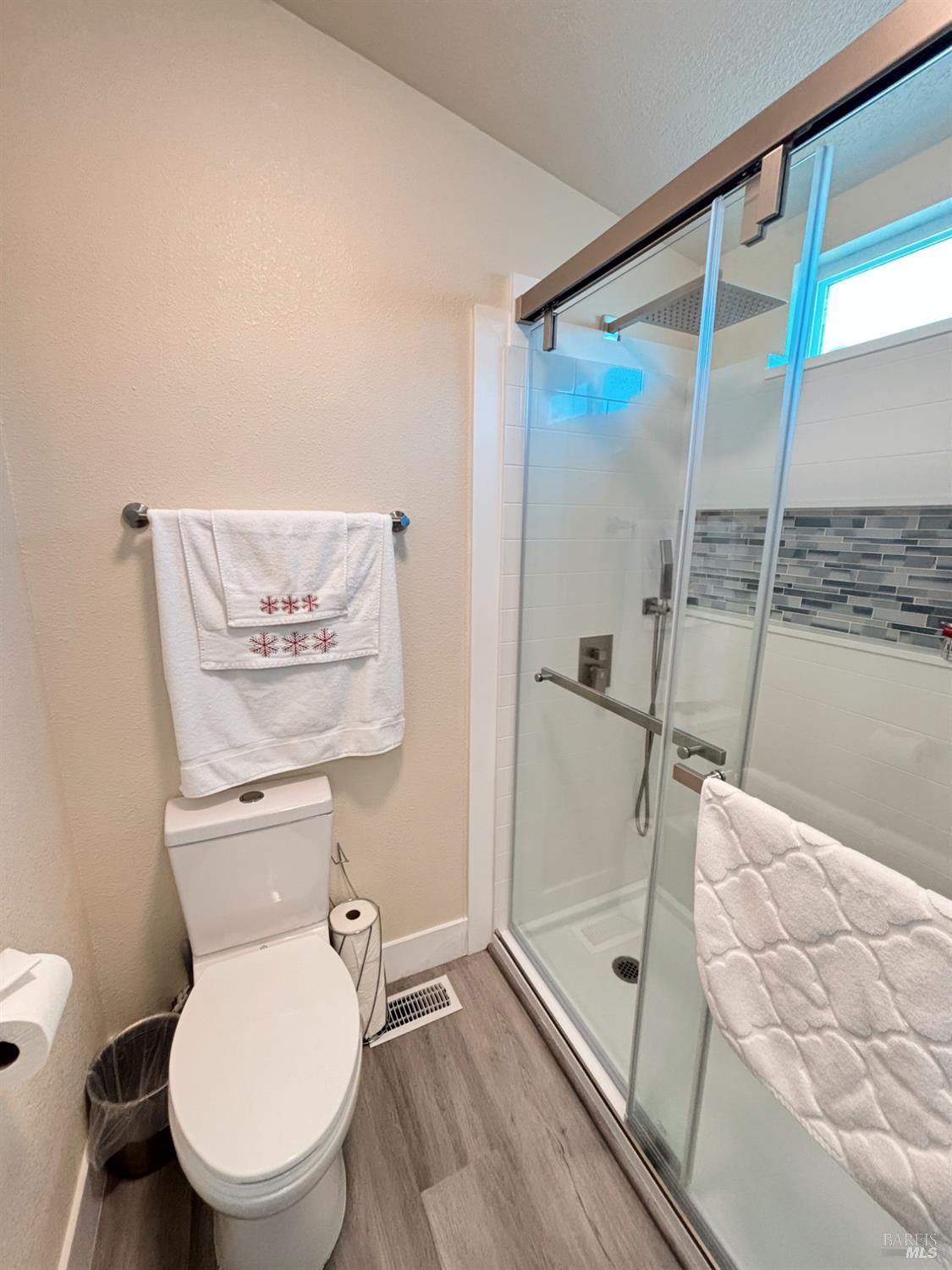 3309 South Santa Rosa Avenue South, Unit 16 Santa Rosa, CA 95407 - Photo 14 of 16 a bathroom with a toilet and a shower