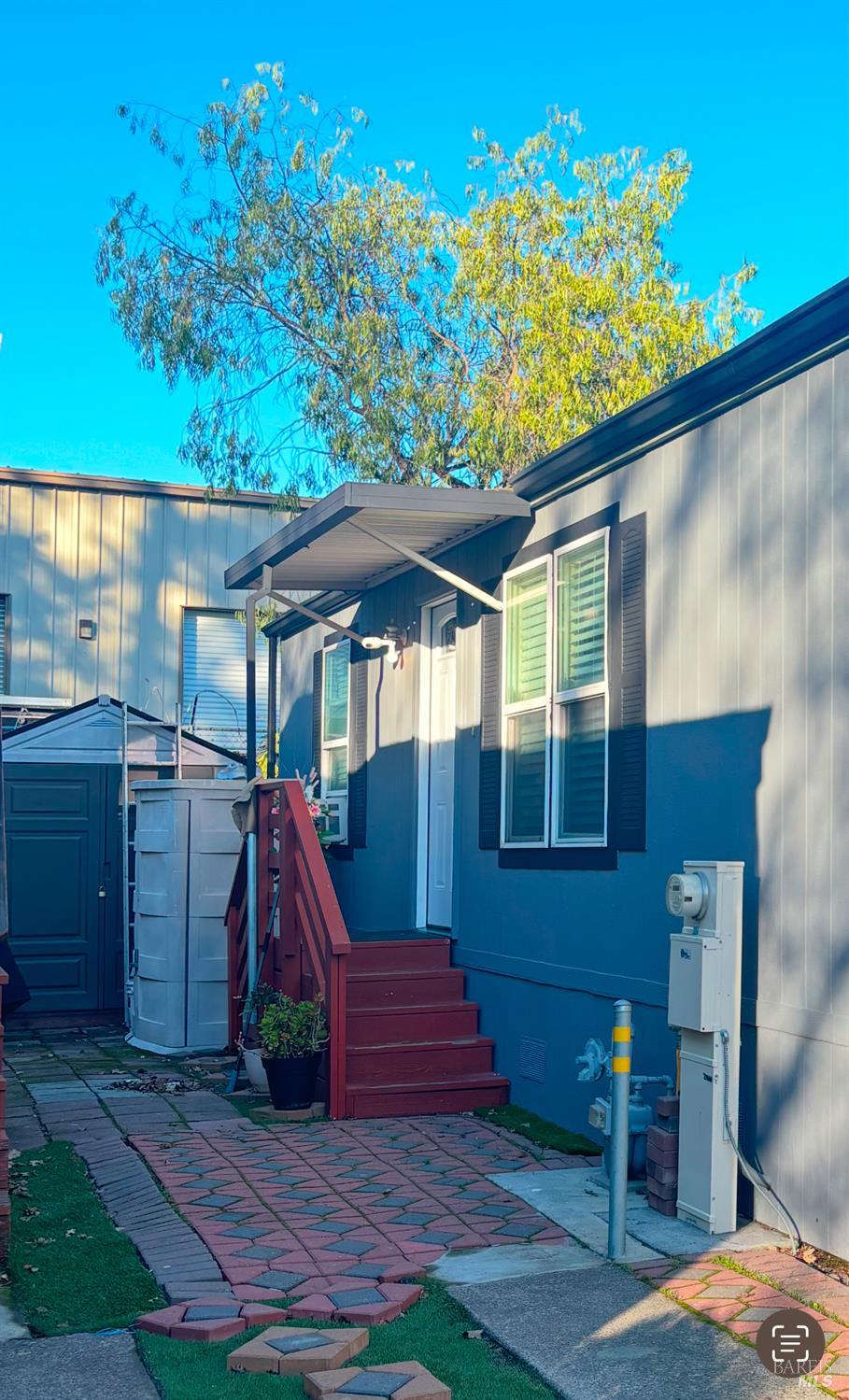 3309 South Santa Rosa Avenue South, Unit 16 Santa Rosa, CA 95407 - Photo 2 of 16 a view of a backyard with a small cabin