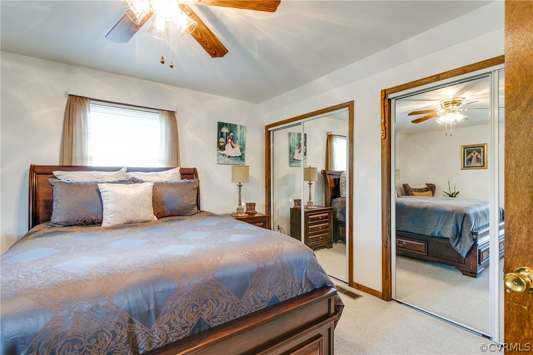 3008 Fielding Road Chester, VA 23831 - Photo 31 of 37 a bedroom with a large bed and a chandelier