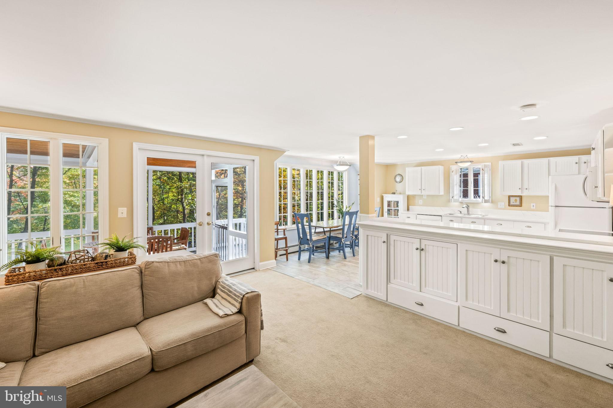 3203 Circle Hill Road Alexandria, VA 22305 - Photo 12 of 48 a living room with furniture a large window and kitchen view