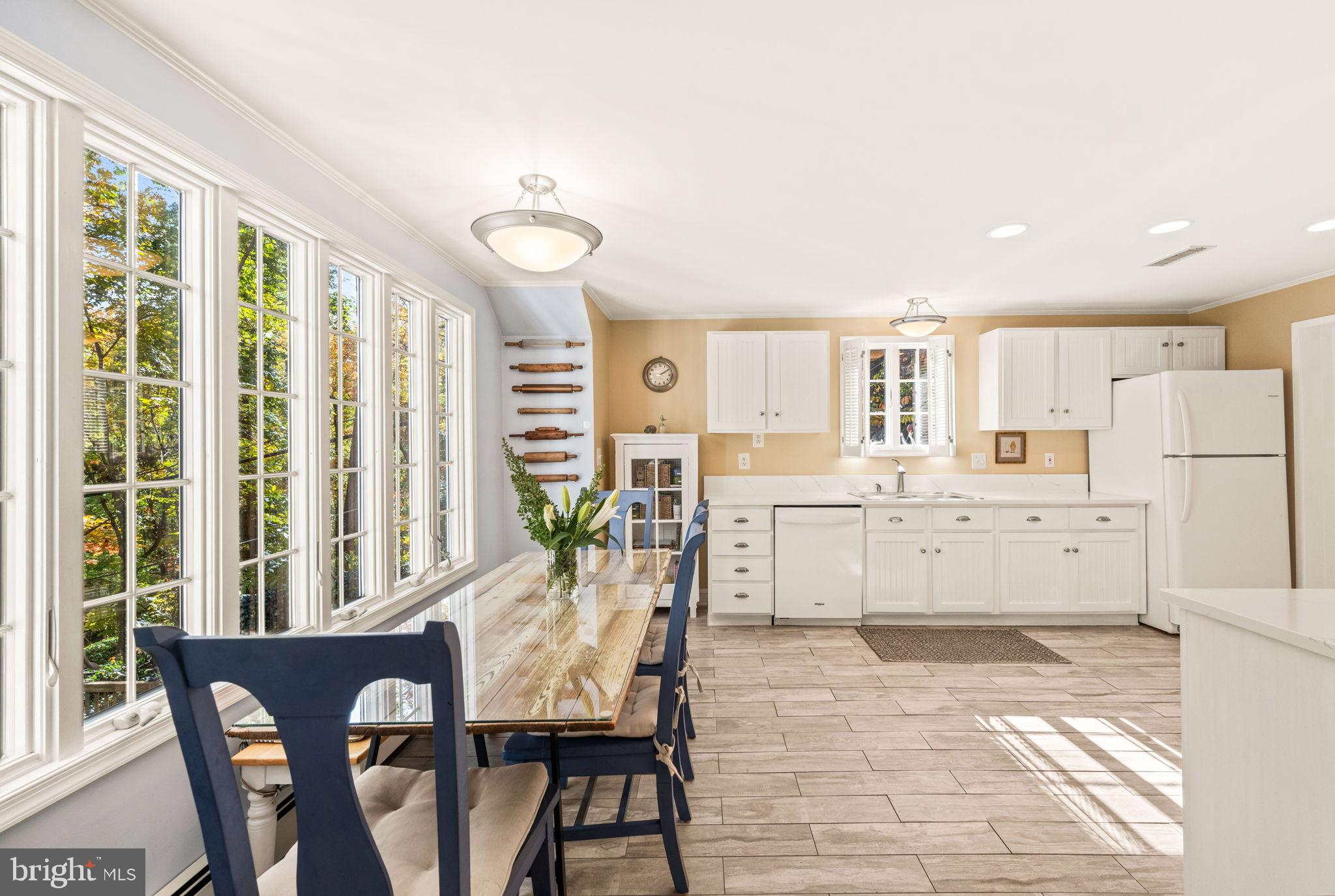 3203 Circle Hill Road Alexandria, VA 22305 - Photo 13 of 48 a dining room with furniture and a large window