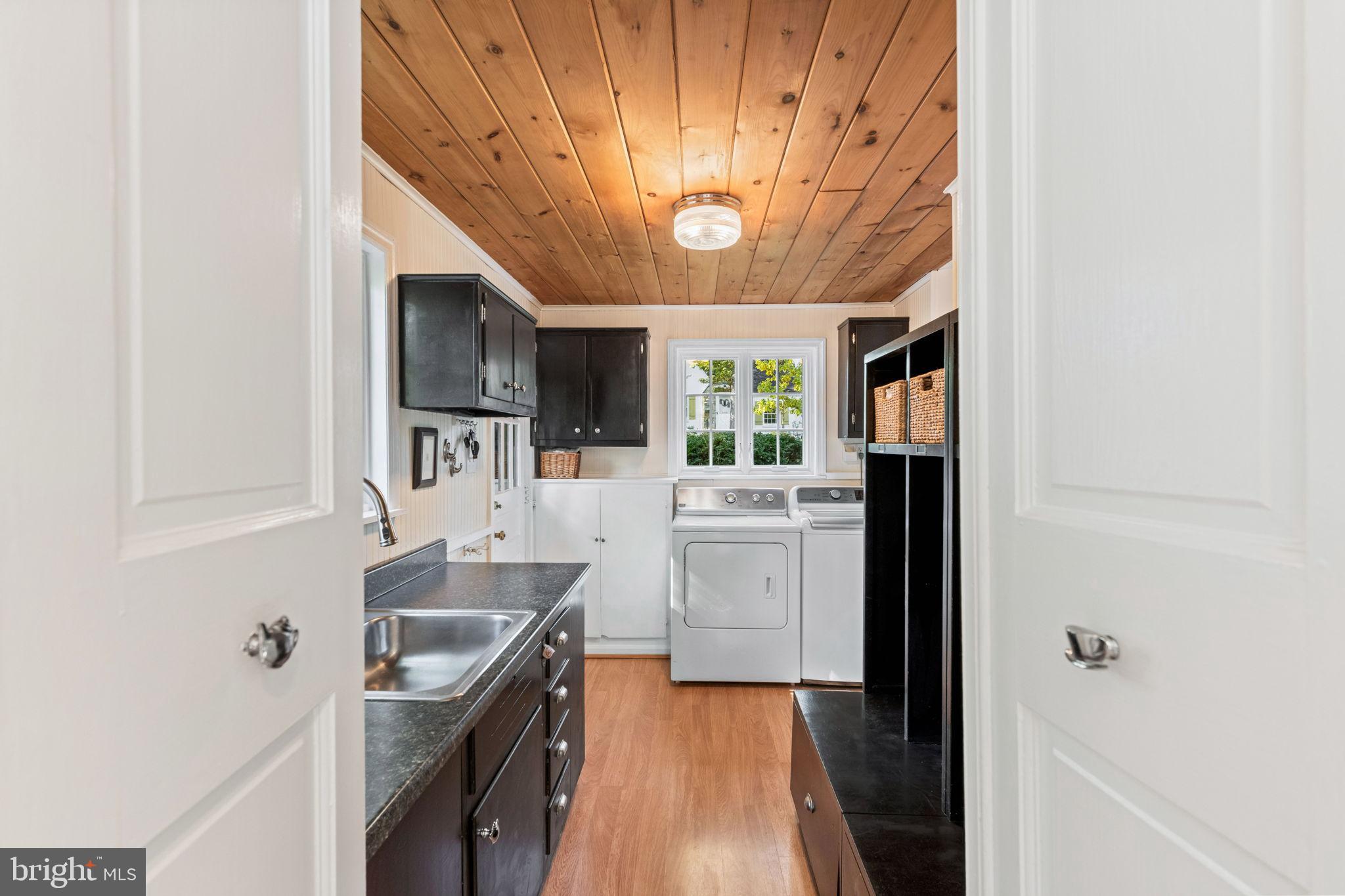 3203 Circle Hill Road Alexandria, VA 22305 - Photo 17 of 48 a kitchen with kitchen island granite countertop a sink appliances cabinets and furniture