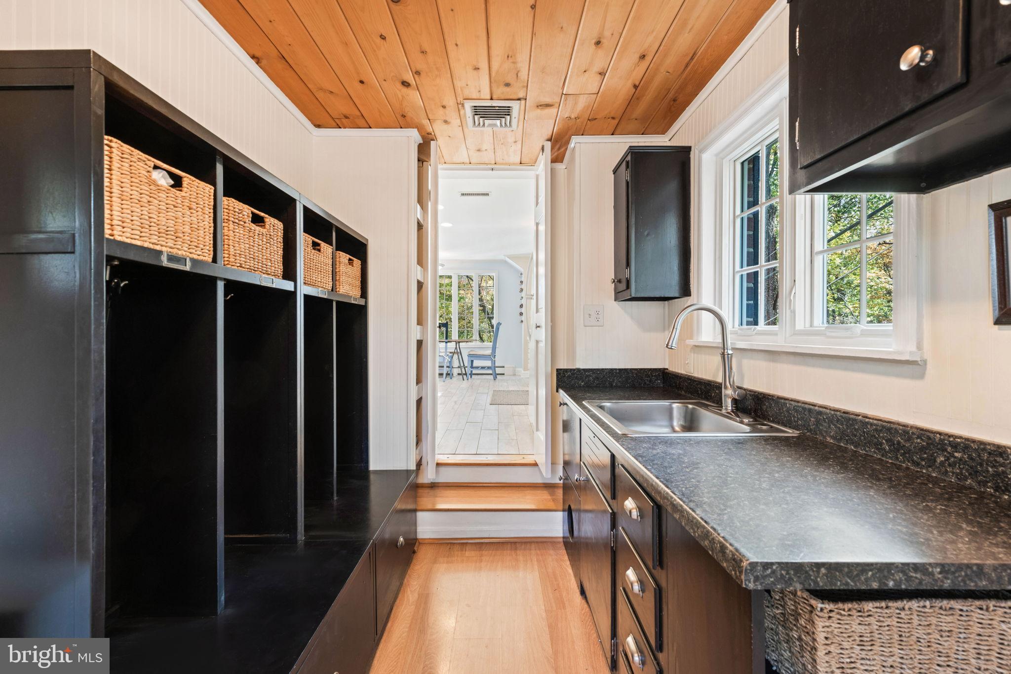 3203 Circle Hill Road Alexandria, VA 22305 - Photo 19 of 48 a kitchen with granite countertop a sink a counter top space and cabinets