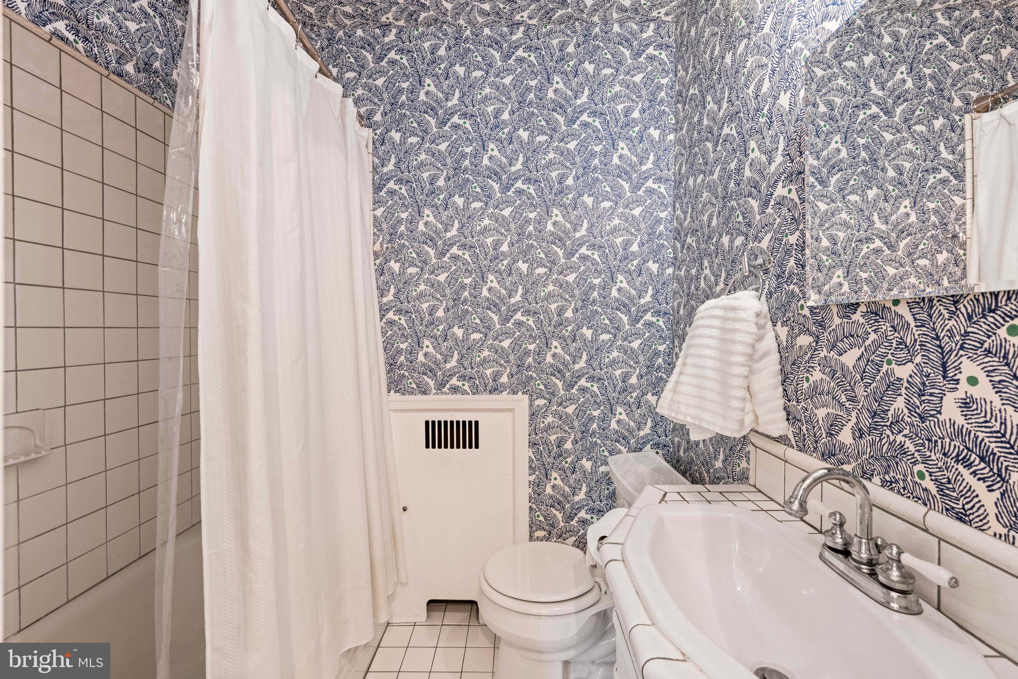 3203 Circle Hill Road Alexandria, VA 22305 - Photo 31 of 48 a bathroom with a sink toilet and shower