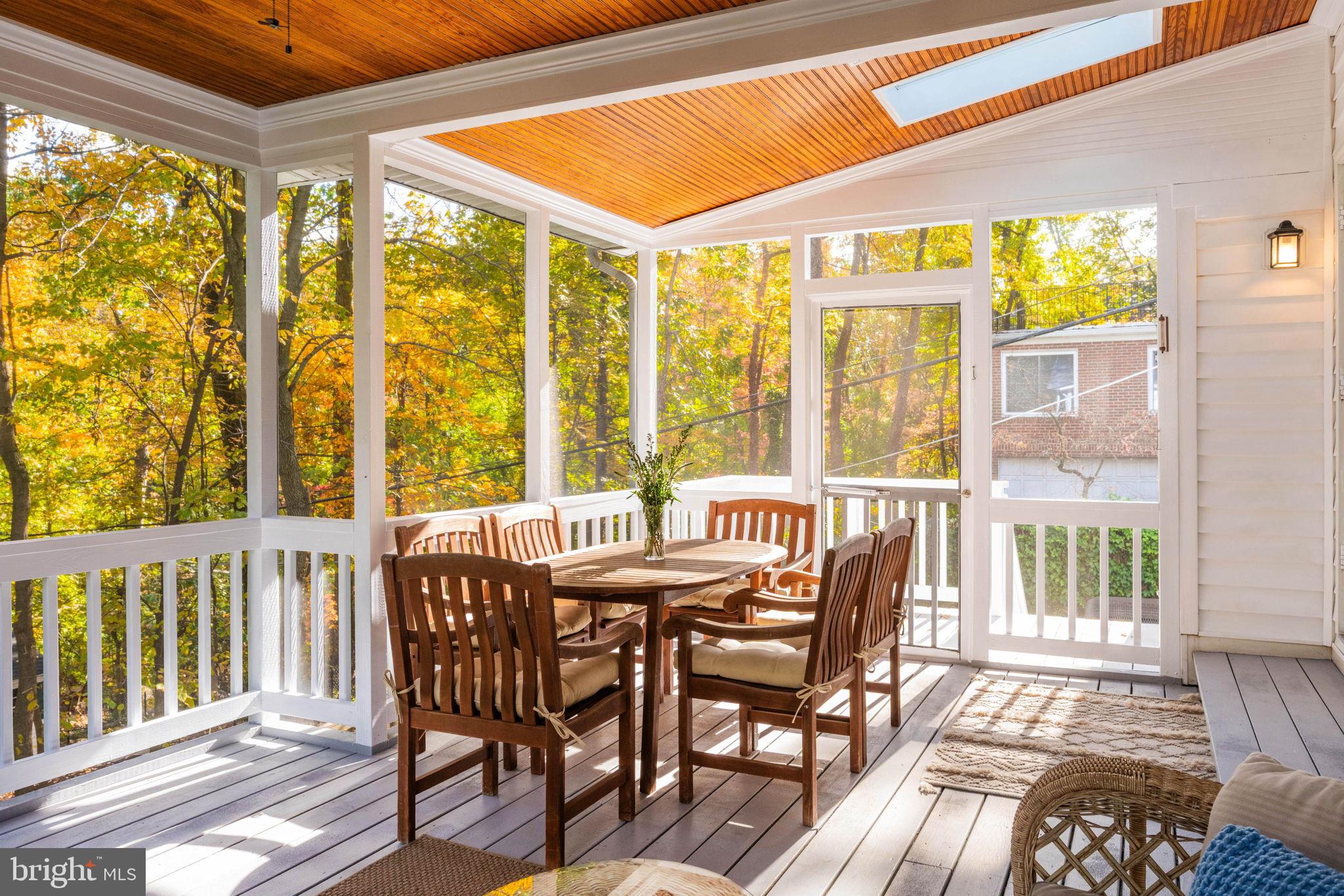 3203 Circle Hill Road Alexandria, VA 22305 - Photo 43 of 48 a view of a dining room with furniture large windows and wooden floor