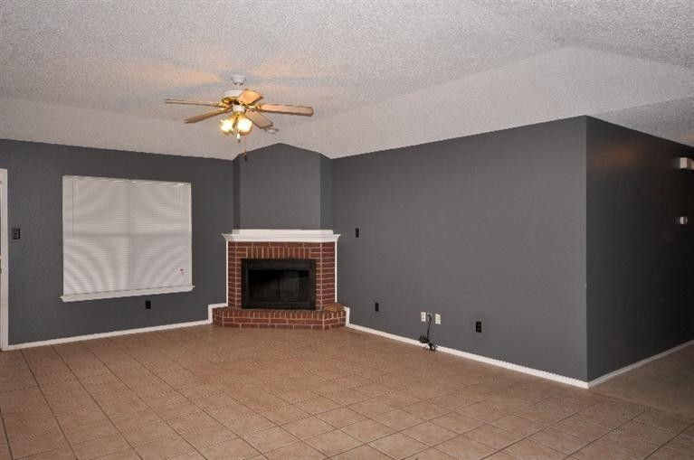 1003 Juneau Avenue Lubbock, TX 79416 - Photo 2 of 10 Living Area with Fireplace