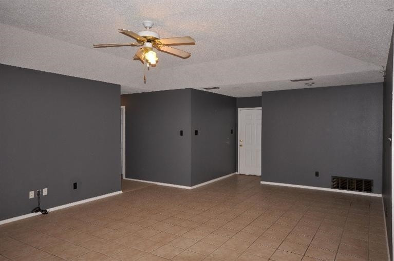 1003 Juneau Avenue Lubbock, TX 79416 - Photo 3 of 10 Living Area with Tile Flooring