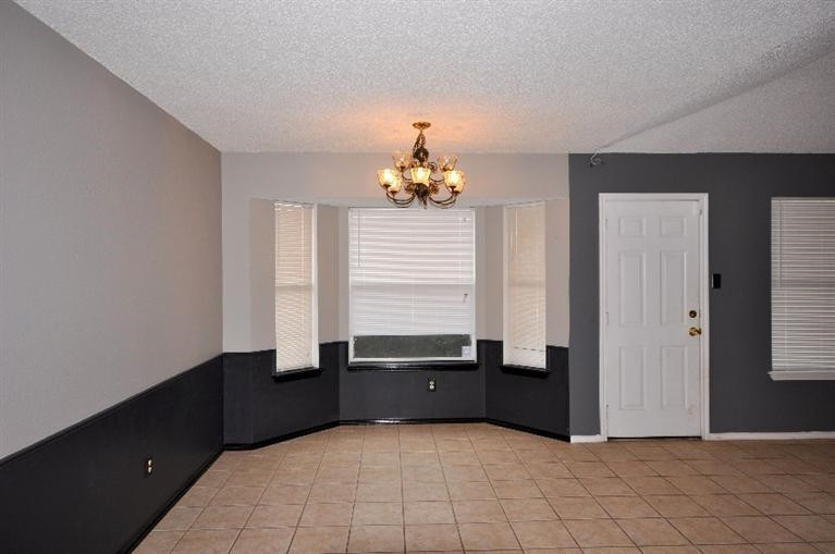 1003 Juneau Avenue Lubbock, TX 79416 - Photo 5 of 10 Dining Area with Tile Flooring