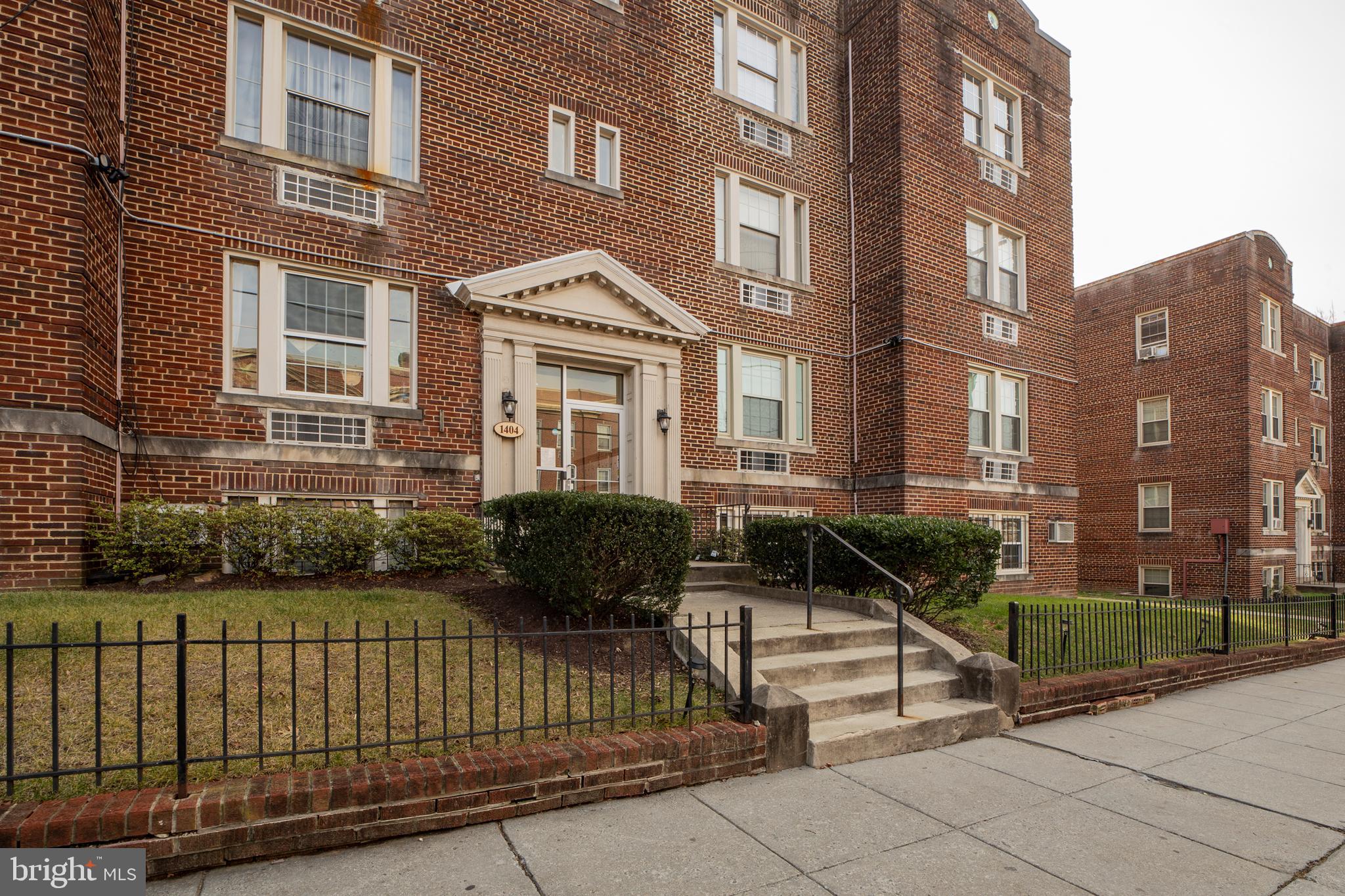 1404 Tuckerman Street Northwest, Unit 1 Washington, DC 20011 - Photo 16 of 18 a view of a brick building and floor to ceiling windows