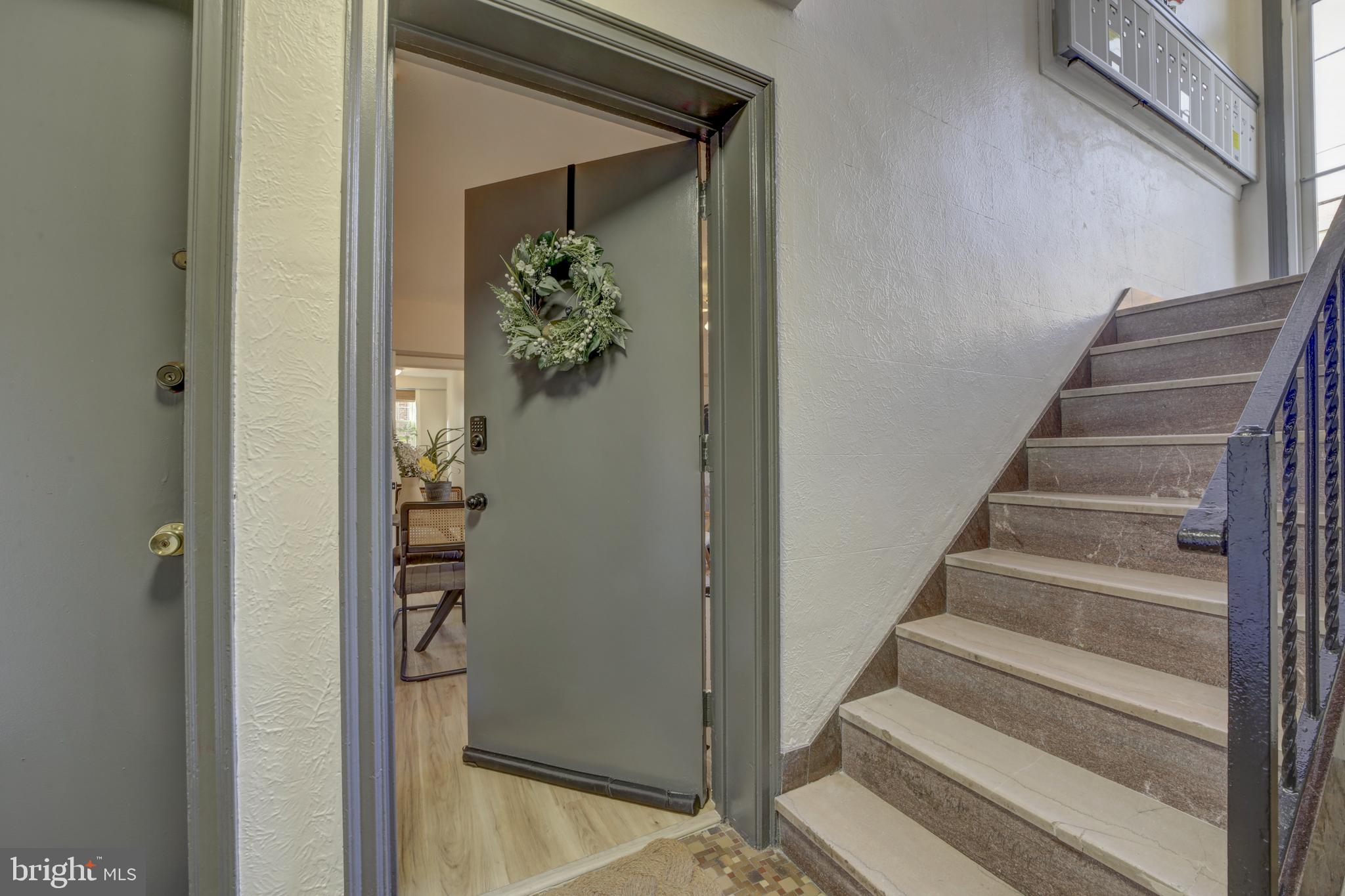 1404 Tuckerman Street Northwest, Unit 1 Washington, DC 20011 - Photo 2 of 18 a view of staircase with white walls and a potted plant