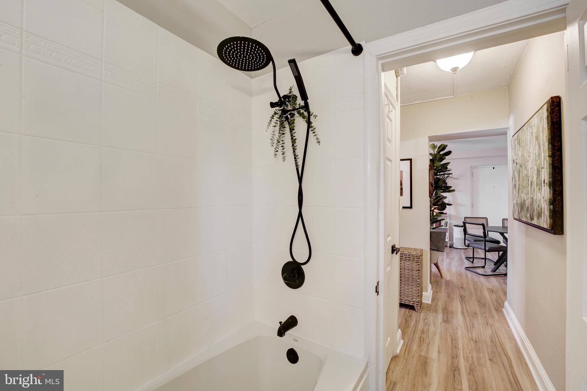 1404 Tuckerman Street Northwest, Unit 1 Washington, DC 20011 - Photo 10 of 18 a bathroom with a shower