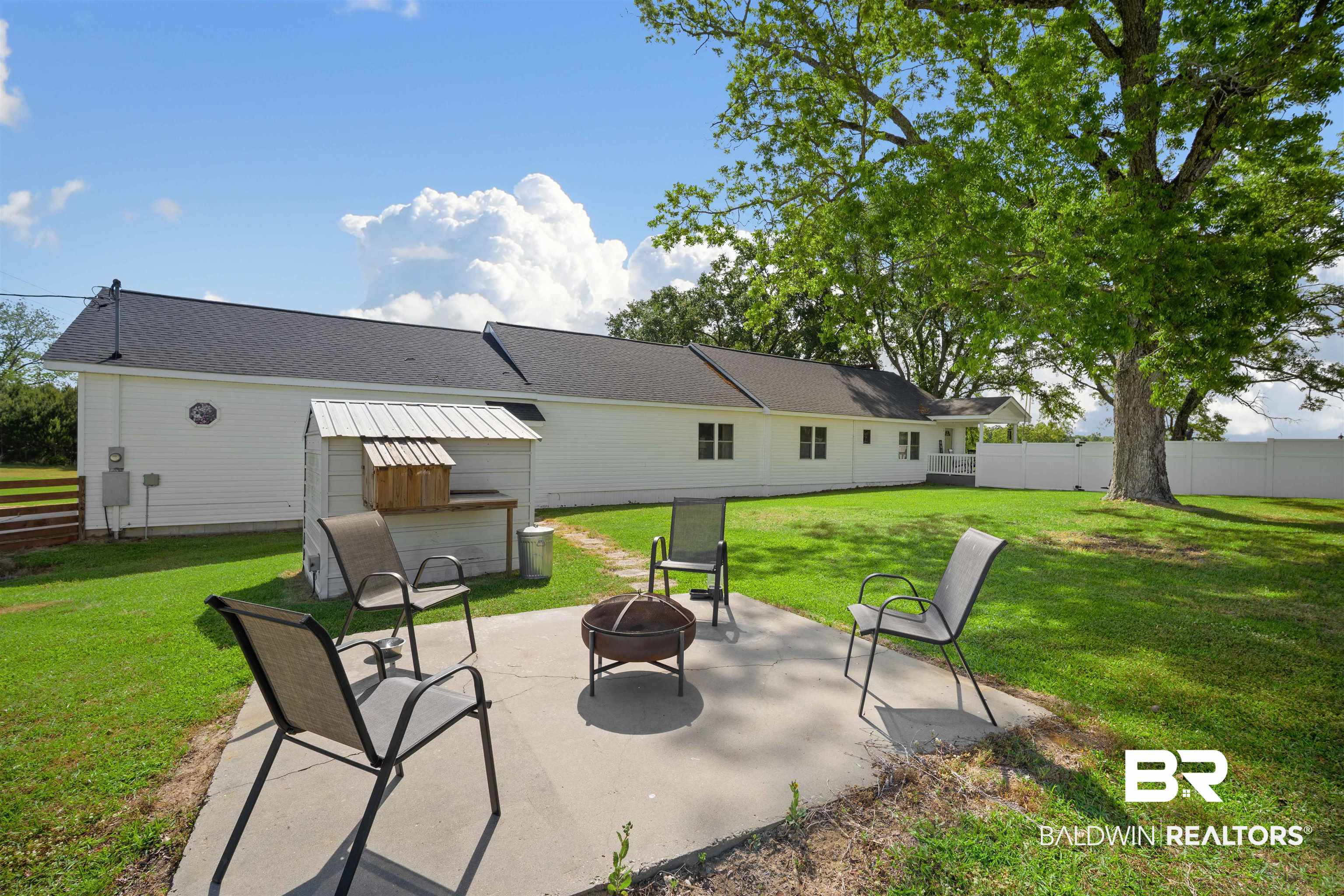 22 Horace Odom Road Millry, AL 36558 - Photo 3 of 39 View of patio featuring a fire pit