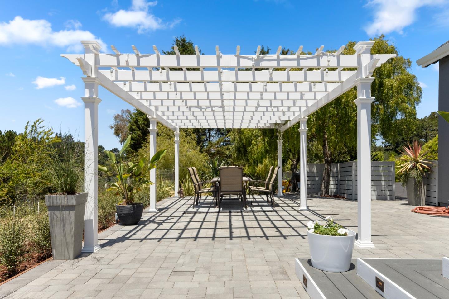 772 Aptos Ridge Circle Watsonville, CA 95076 - Photo 21 of 62 a view of a patio with couches table and chairs and potted plants