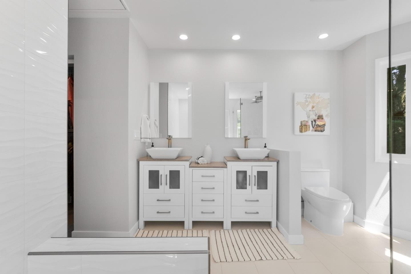 772 Aptos Ridge Circle Watsonville, CA 95076 - Photo 45 of 62 a large white bathroom with a double vanity sink a mirror and a
