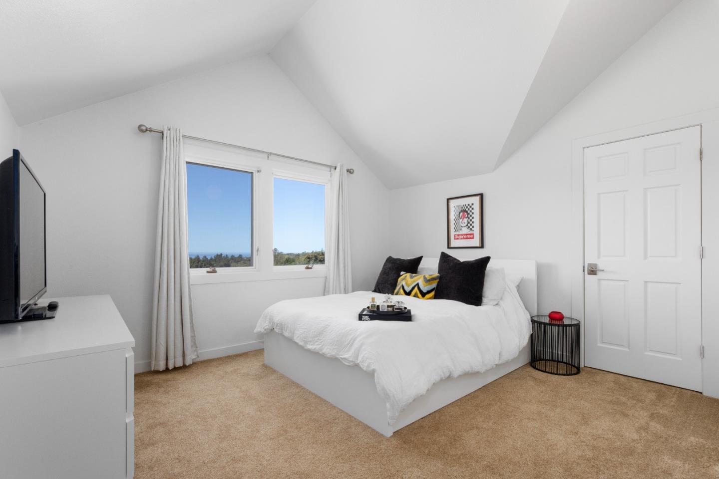 772 Aptos Ridge Circle Watsonville, CA 95076 - Photo 47 of 62 a bedroom with a bed and a flat tv screen on dresser