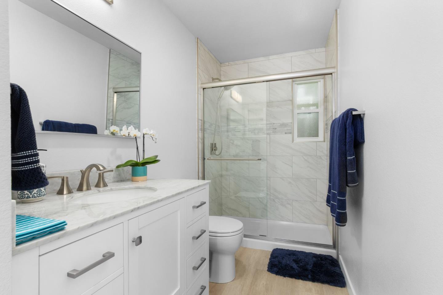 772 Aptos Ridge Circle Watsonville, CA 95076 - Photo 54 of 62 a bathroom with a granite countertop sink toilet and shower