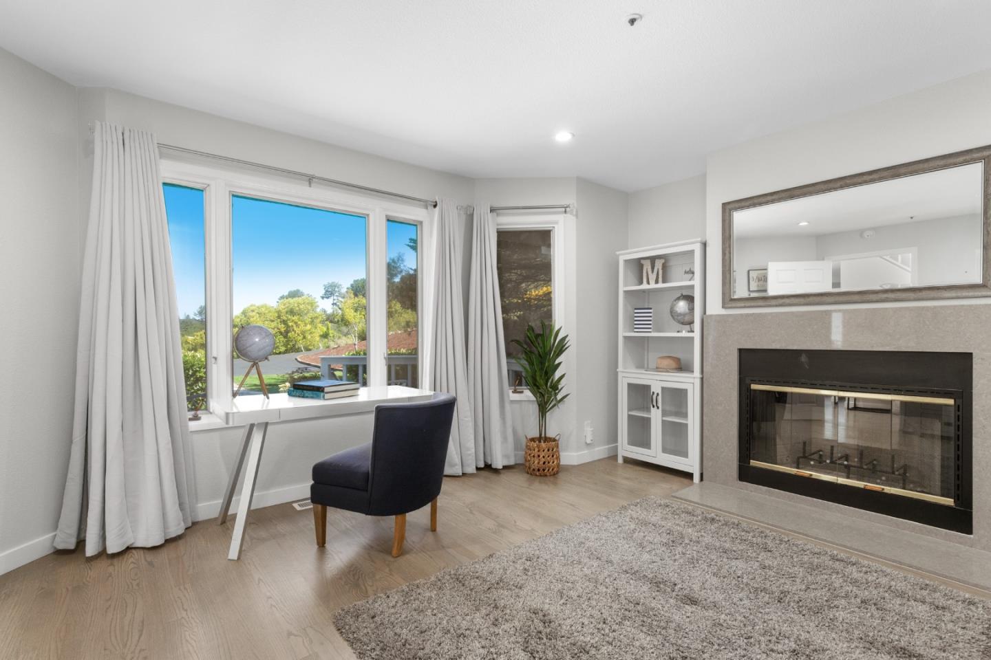 772 Aptos Ridge Circle Watsonville, CA 95076 - Photo 55 of 62 a living room with furniture and a fireplace