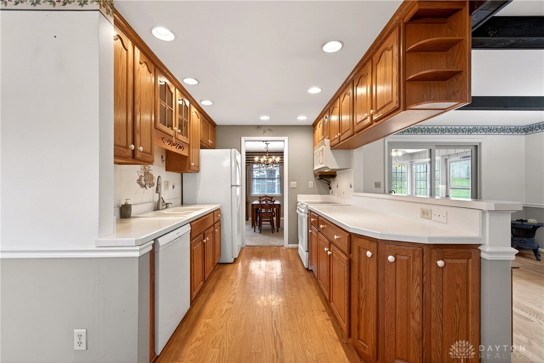 1547 Ambridge Road Centerville, OH 45459 - Photo 14 of 79 This galley kitchen features light wood cabinetry, recessed lighting, and durable wood flooring.