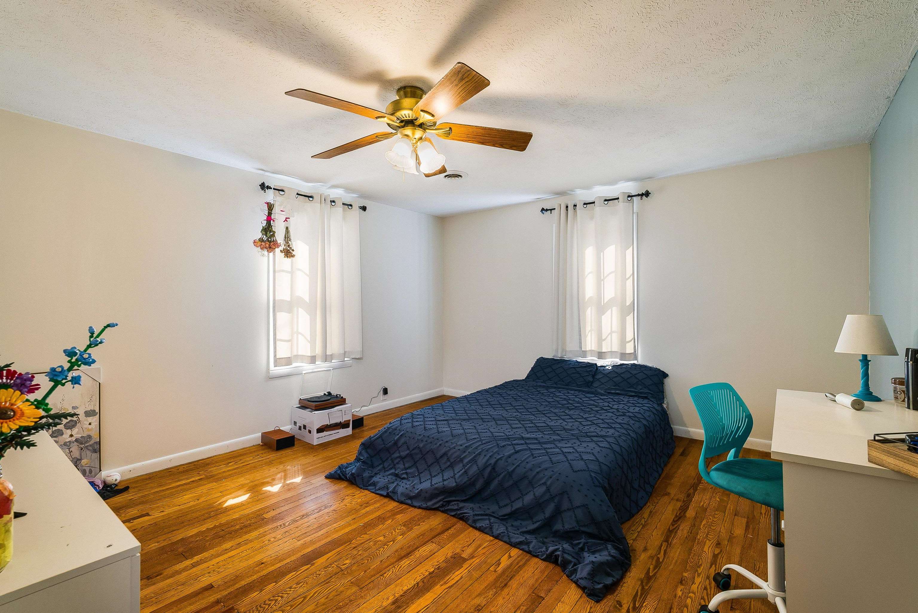 7110 Rocky Bar Road Elkton, VA 22827 - Photo 24 of 52 a bedroom with a bed and a chandelier