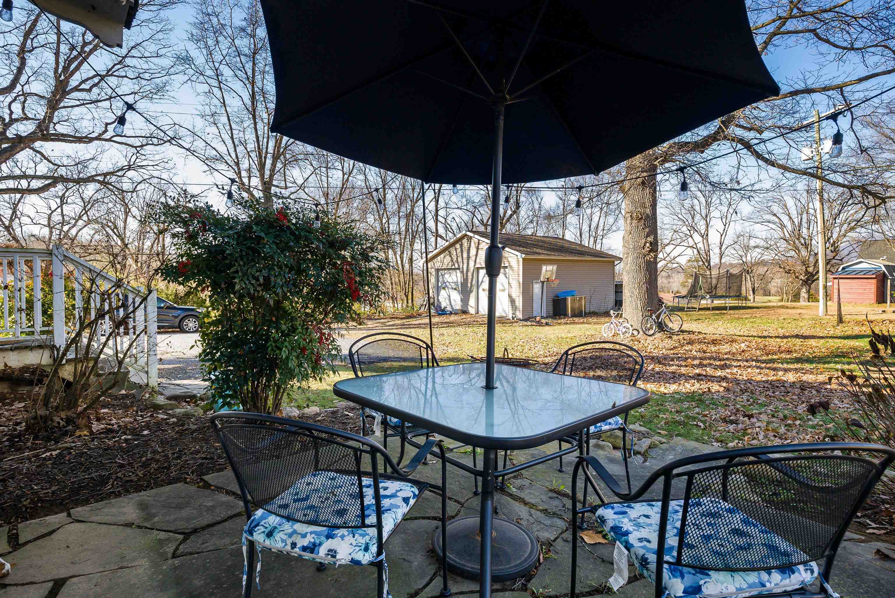 7110 Rocky Bar Road Elkton, VA 22827 - Photo 36 of 52 a view of a patio with a table and chairs under an umbrella