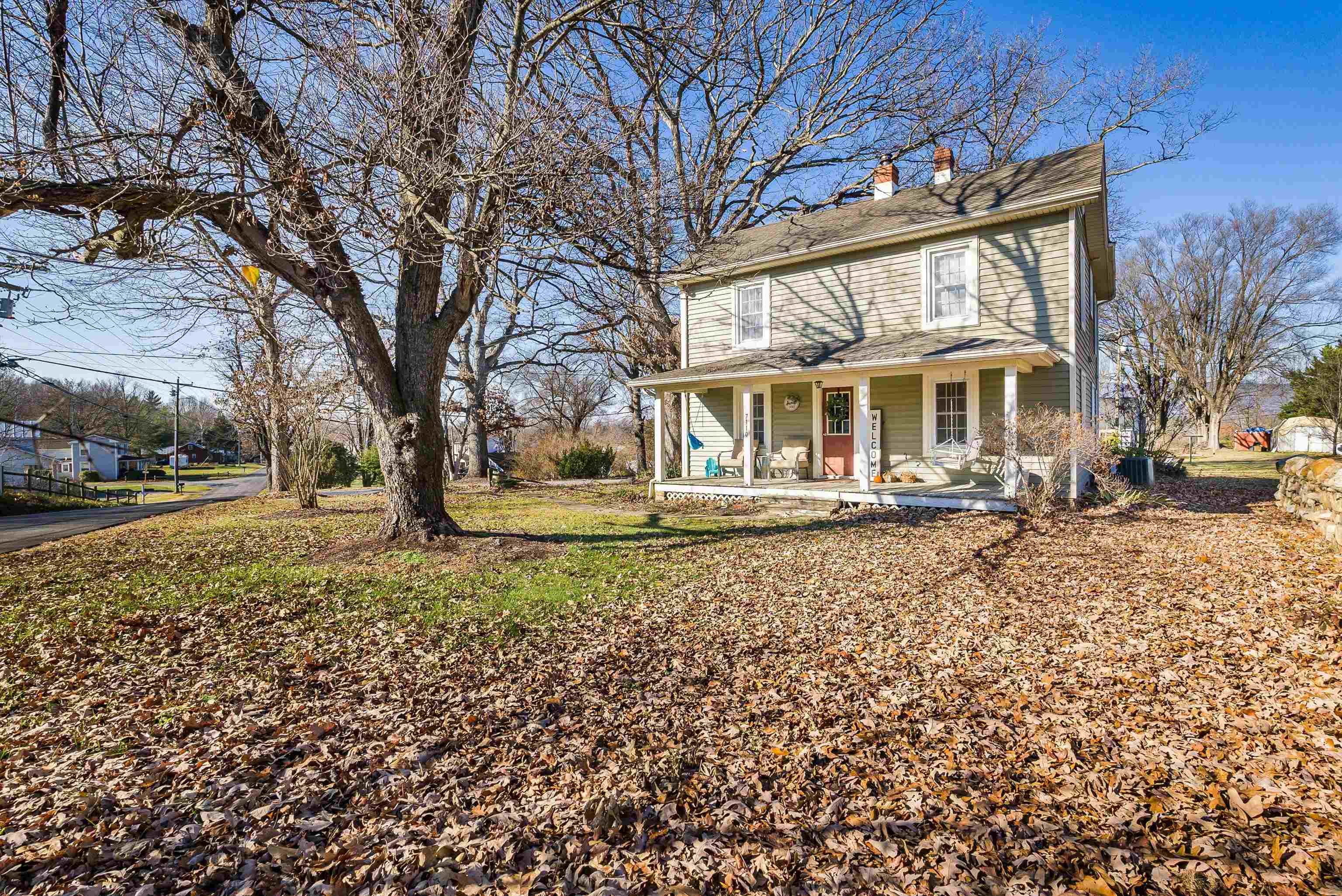 7110 Rocky Bar Road Elkton, VA 22827 - Photo 49 of 52 a front view of a house with a yard covered with snow and trees