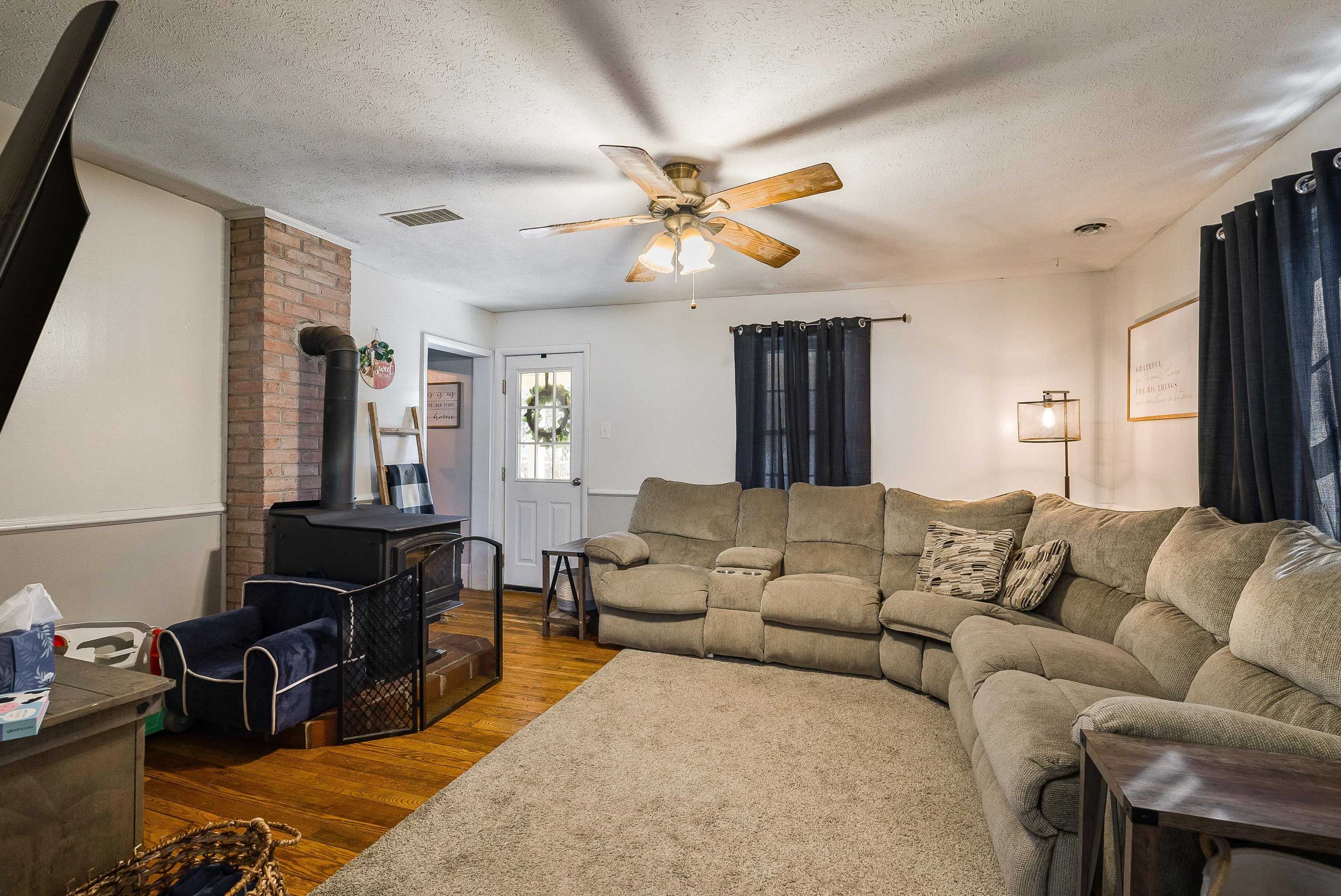 7110 Rocky Bar Road Elkton, VA 22827 - Photo 7 of 52 a living room with furniture ceiling fan and a window