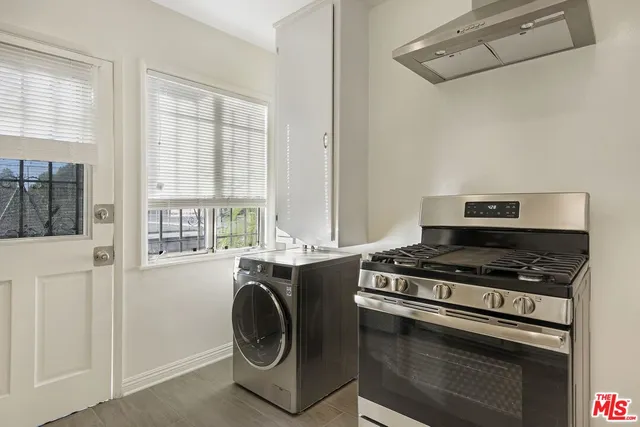 a view of a kitchen with washer and dryer