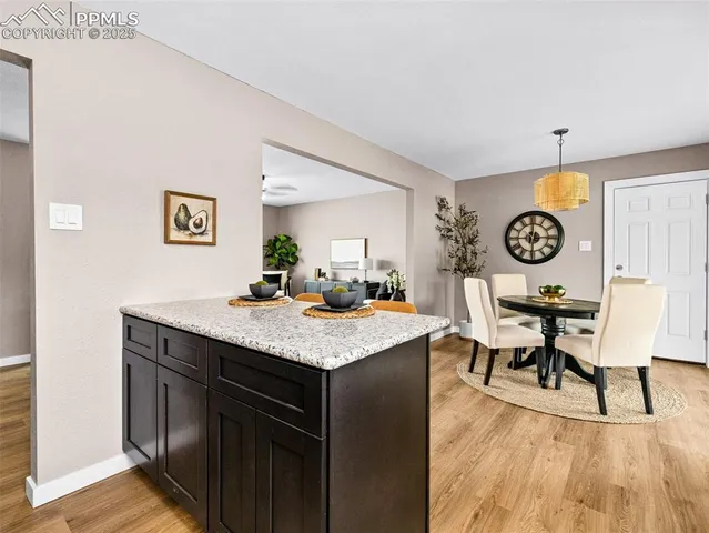 a kitchen with a table and chairs in it