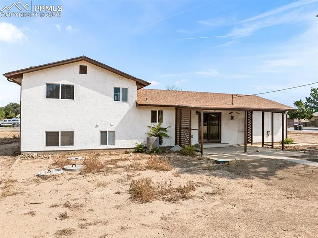 a view of a backyard of a house