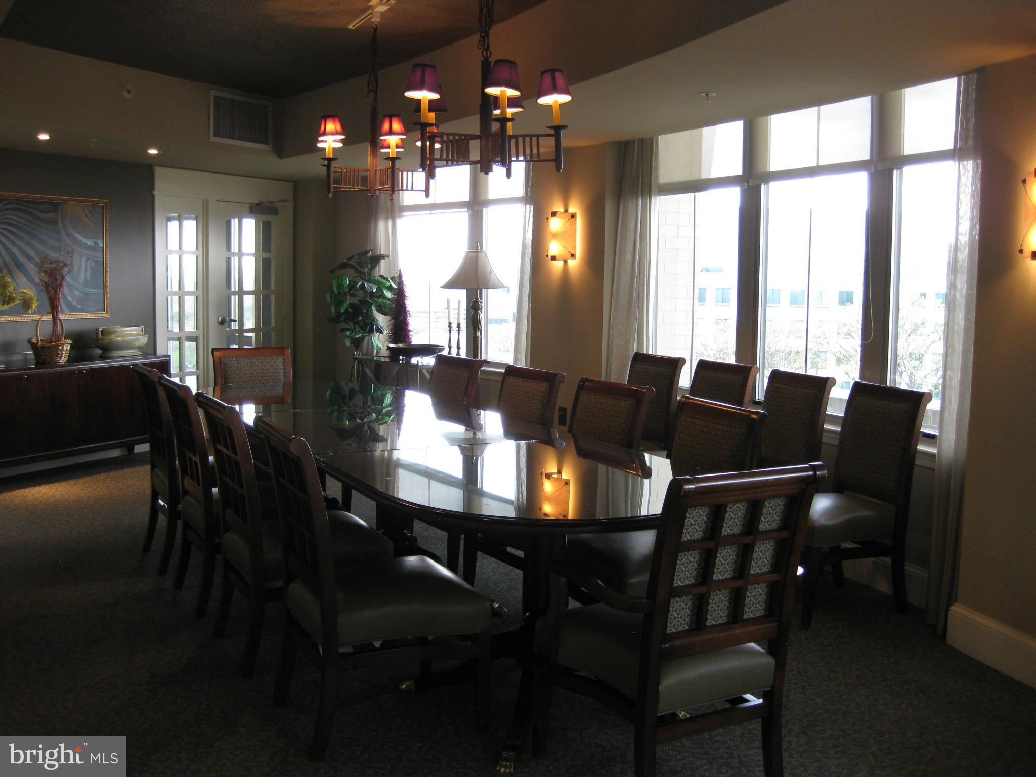 11800 Sunset Hills Road, Unit 925 Reston, VA 20190 - Photo 27 of 29 a view of a dining room with furniture and chandelier