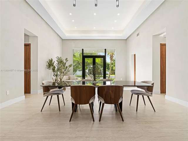 a kitchen with a table and chairs in it