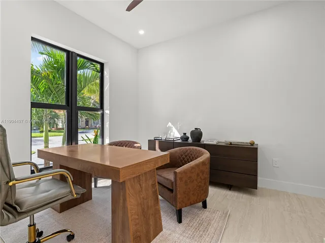 a bathroom with a sink vanity granite shower and a mirror