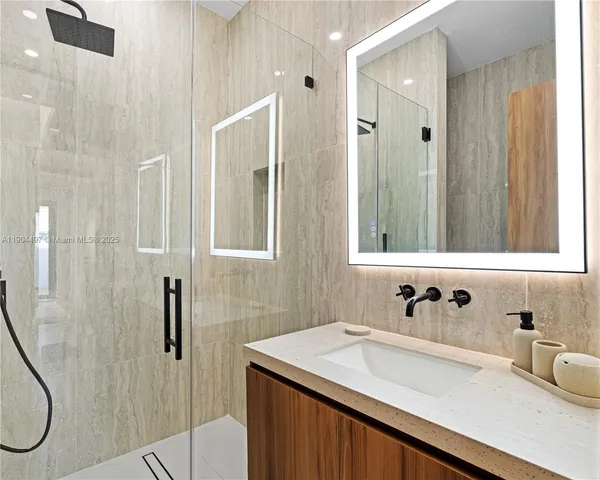 a bedroom with a large bed and a large window