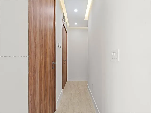 a large white room with a large window and couch