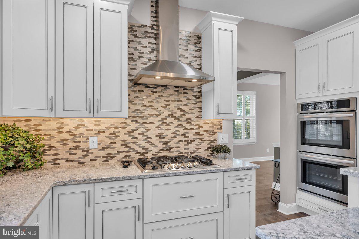 128 Willow Grove Road Shamong, NJ 08088 - Photo 18 of 84 a kitchen with stainless steel appliances white cabinets and a granite counter tops