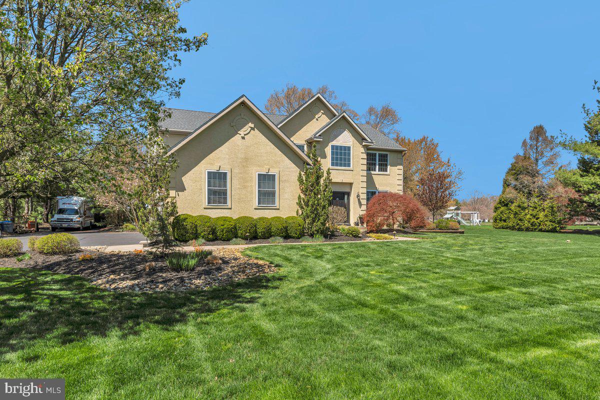 128 Willow Grove Road Shamong, NJ 08088 - Photo 3 of 84 a front view of a house with a yard