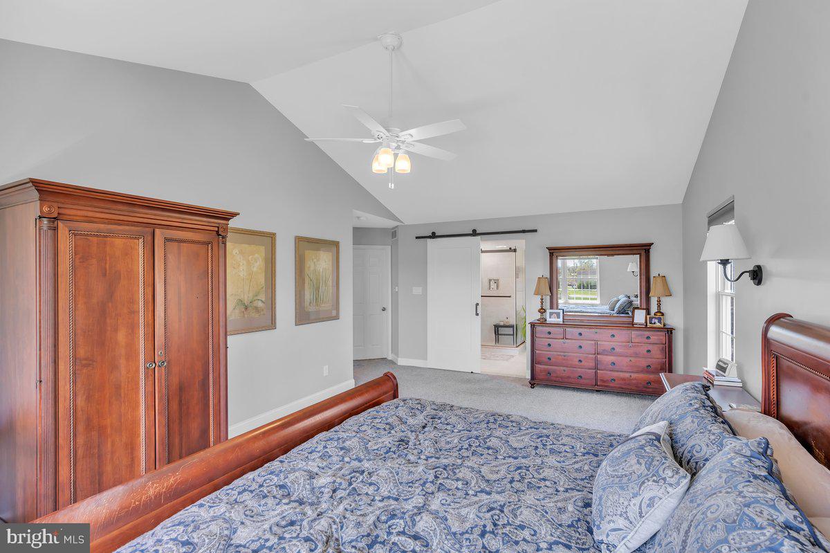 128 Willow Grove Road Shamong, NJ 08088 - Photo 34 of 84 a spacious bedroom with a bed and wooden floor