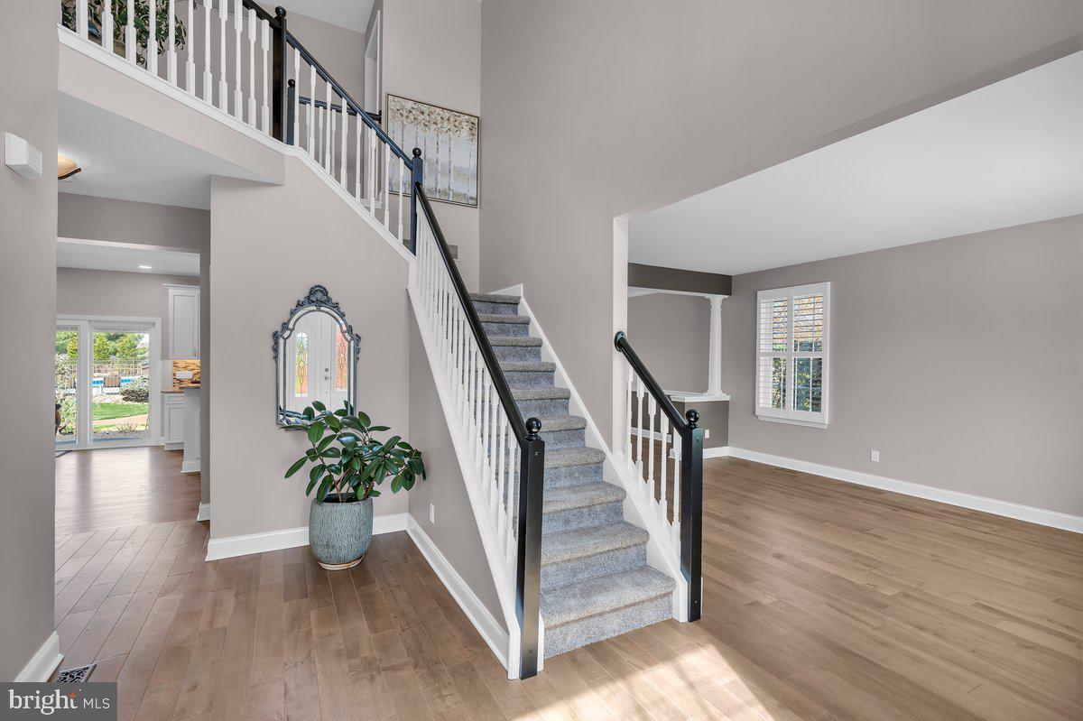 128 Willow Grove Road Shamong, NJ 08088 - Photo 7 of 84 a view of an entryway with wooden floor and a potted plant