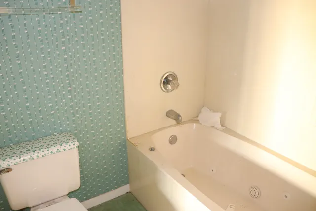 a bathroom with a bathtub and a sink